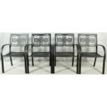 A set of four metal framed garden chairs with latticework seats. H.87