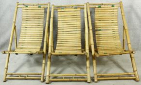 Three bamboo and slatted deck chairs. H.96cm (one in need of repair as photographed).
