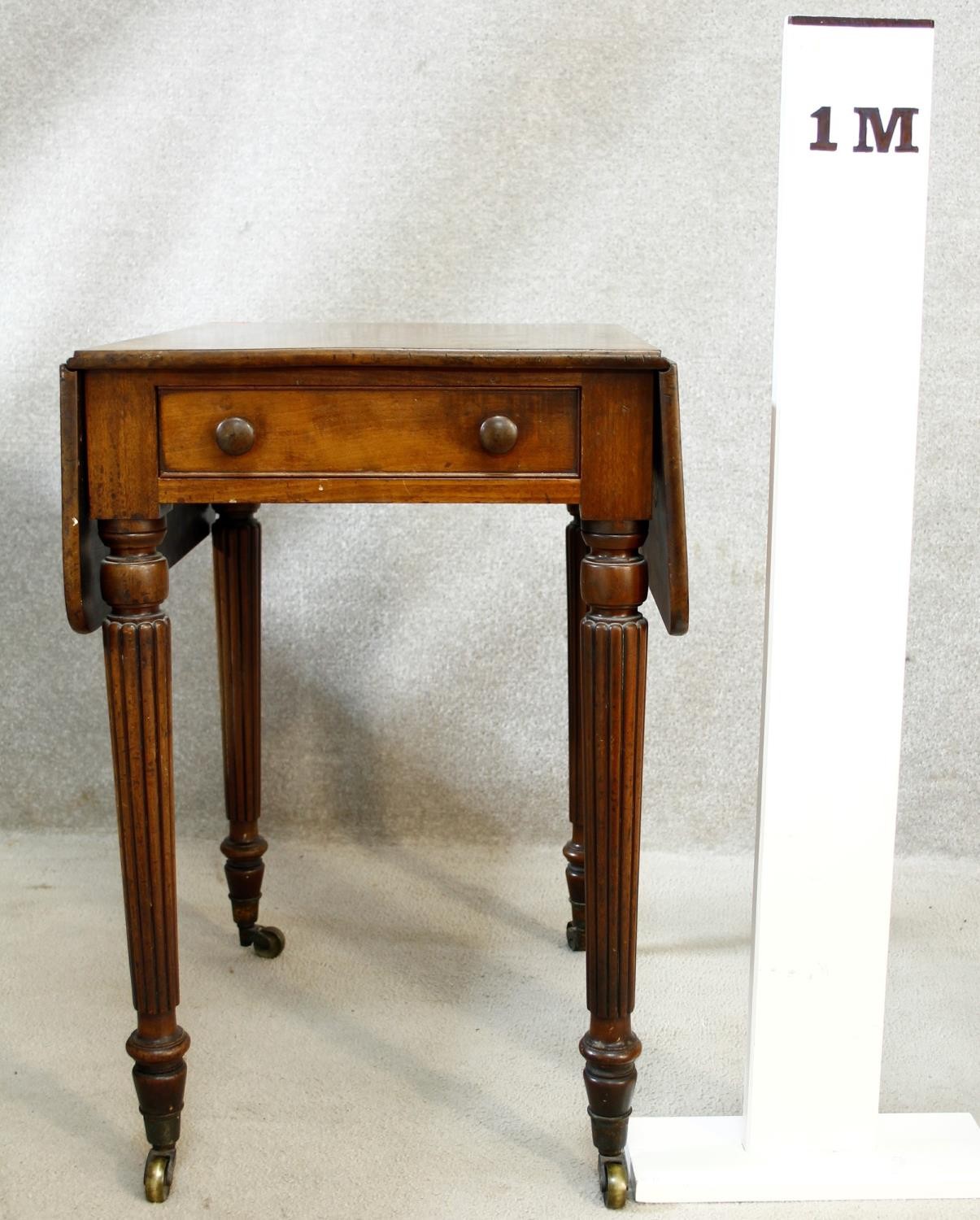 A small late Georgian mahogany drop flap Pembroke table with end drawer on tapering reeded - Image 6 of 6