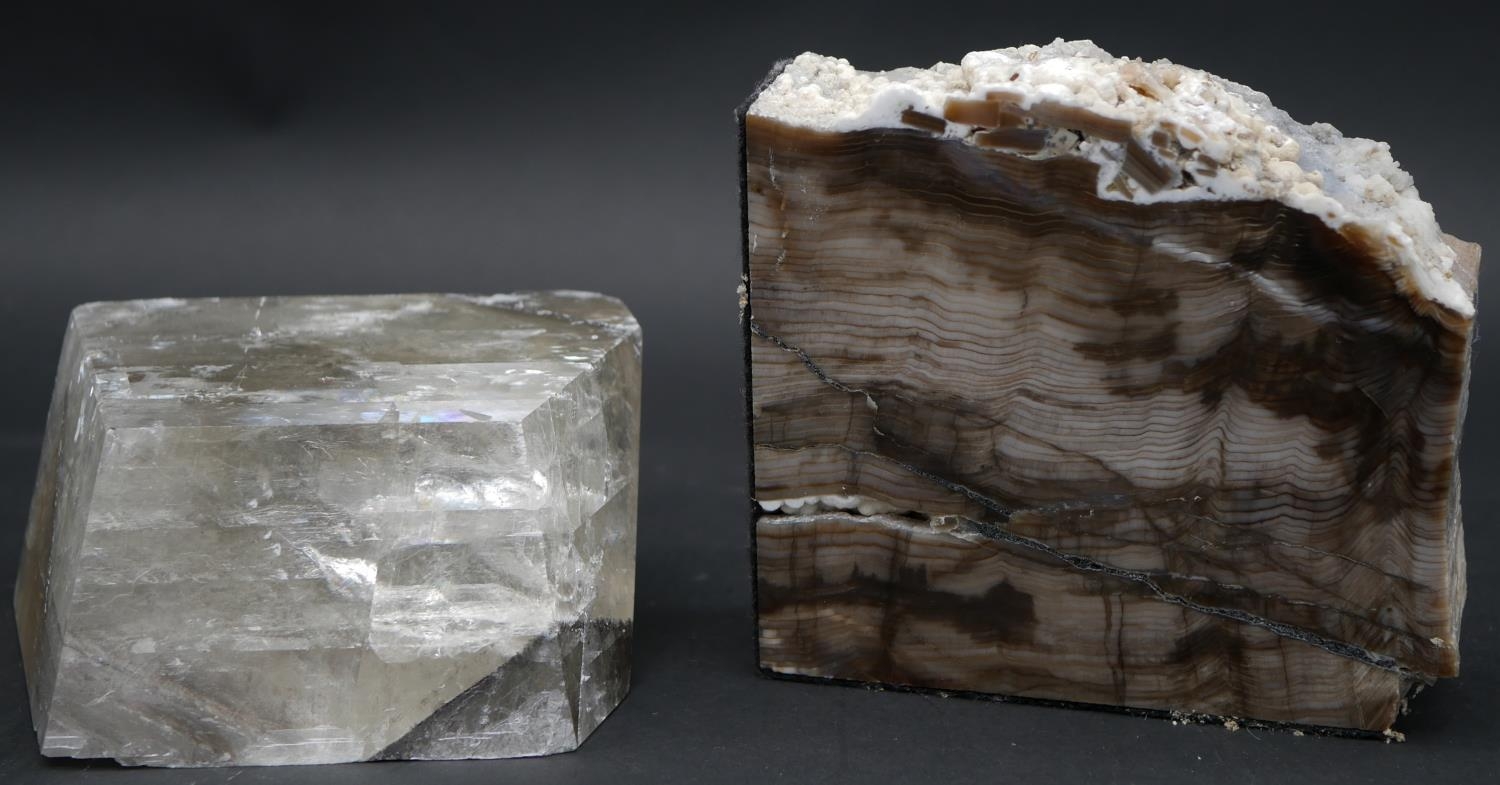 A large smokey quartz crystal and a piece of polished petrified wood. H.13 L.14 W.4.5cm (Petrified