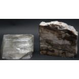 A large smokey quartz crystal and a piece of polished petrified wood. H.13 L.14 W.4.5cm (Petrified