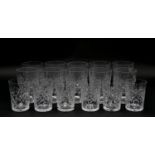 A collection of sixteen glass tumblers with stylized foliate design. Various sizes. H.10.5cm