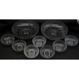 A collection of nine frosted cut glass bowls with engraved stylised foliate design and star cut