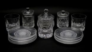 A collection of cut crystal items. Inlcuding a set of eleven side plates with star cut design, three