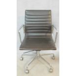 A vintage Charles and Ray Eames inspired Aluminium Group style office desk armchair in black