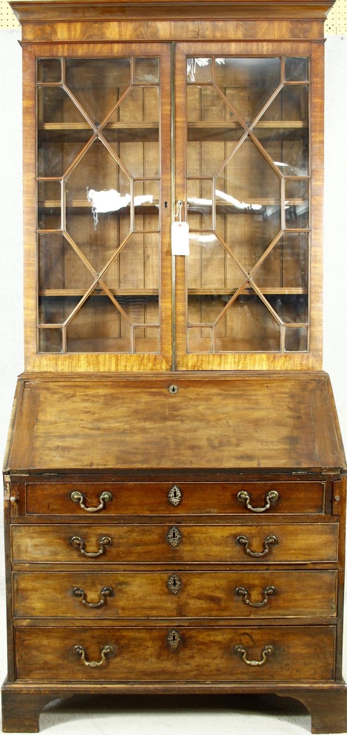A Georgian mahogany two section bureau bookcase with upper astragal glazed top above fall front
