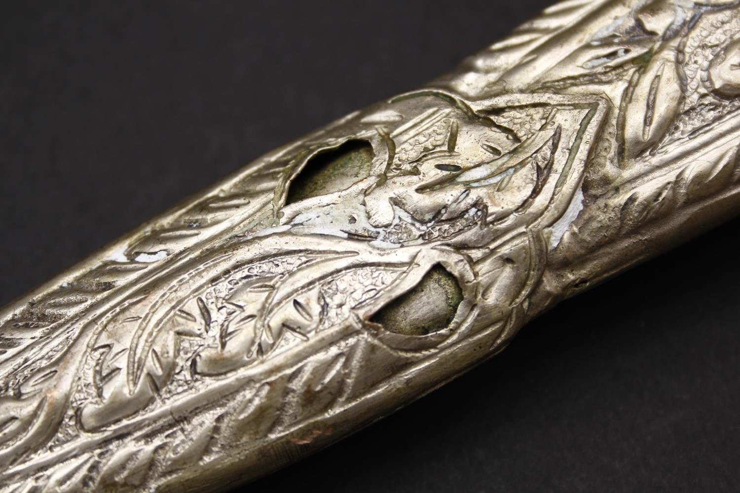 An Indian white metal foliate repousse and floral engraved sword scabbard and hilt set with fourteen - Image 4 of 5