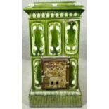An late 19th century indoor stove with Art Nouveau ceramic tiling. H.64 W.36 D.53cm