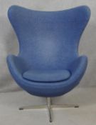 After Arne Jacobsen (1902-1971) Egg chair in blue upholstery and rise and fall action on four