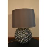 A contemporary table lamp of chrome and glass cabochons with shade. H.60 W.38cm