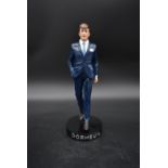 A limited edition Dormeuil advertising figure, 140 of 400, in presentation box. H.35 W.18cm (box)