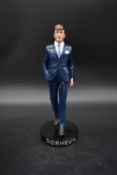 A limited edition Dormeuil advertising figure, 140 of 400, in presentation box. H.35 W.18cm (box)