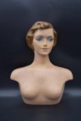 A 1940's moulded laminated lady's dress shop mannequin. H.54 W.40cm