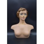 A 1940's moulded laminated lady's dress shop mannequin. H.54 W.40cm