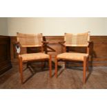 A pair of mid century Danish teak armchairs by Eric Worts with woven cane backs and seats. H.80 W.50