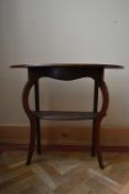 A C.1900 carved mahogany console table on cabriole supports united by an under tier. H.73 W.86 D.