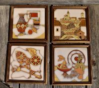 A set of four framed ceramic tiles. H.29 W.29cm