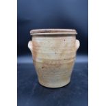 A stoneware twin handled pot with bread board lid. H.29 W.25cm