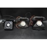 A vintage rotary dial bakelite telephone, another similar and a 1960's example. H.26 W.23 D.15cm