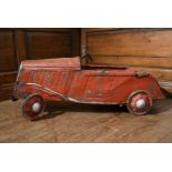 An early 20th century child's pedal car in original condition. H.44 W.100 D.33cm