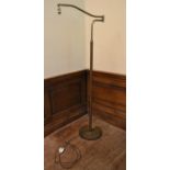 A vintage brass standard reading light with shaped swing arm. H.152 W.53 Dia.30cm