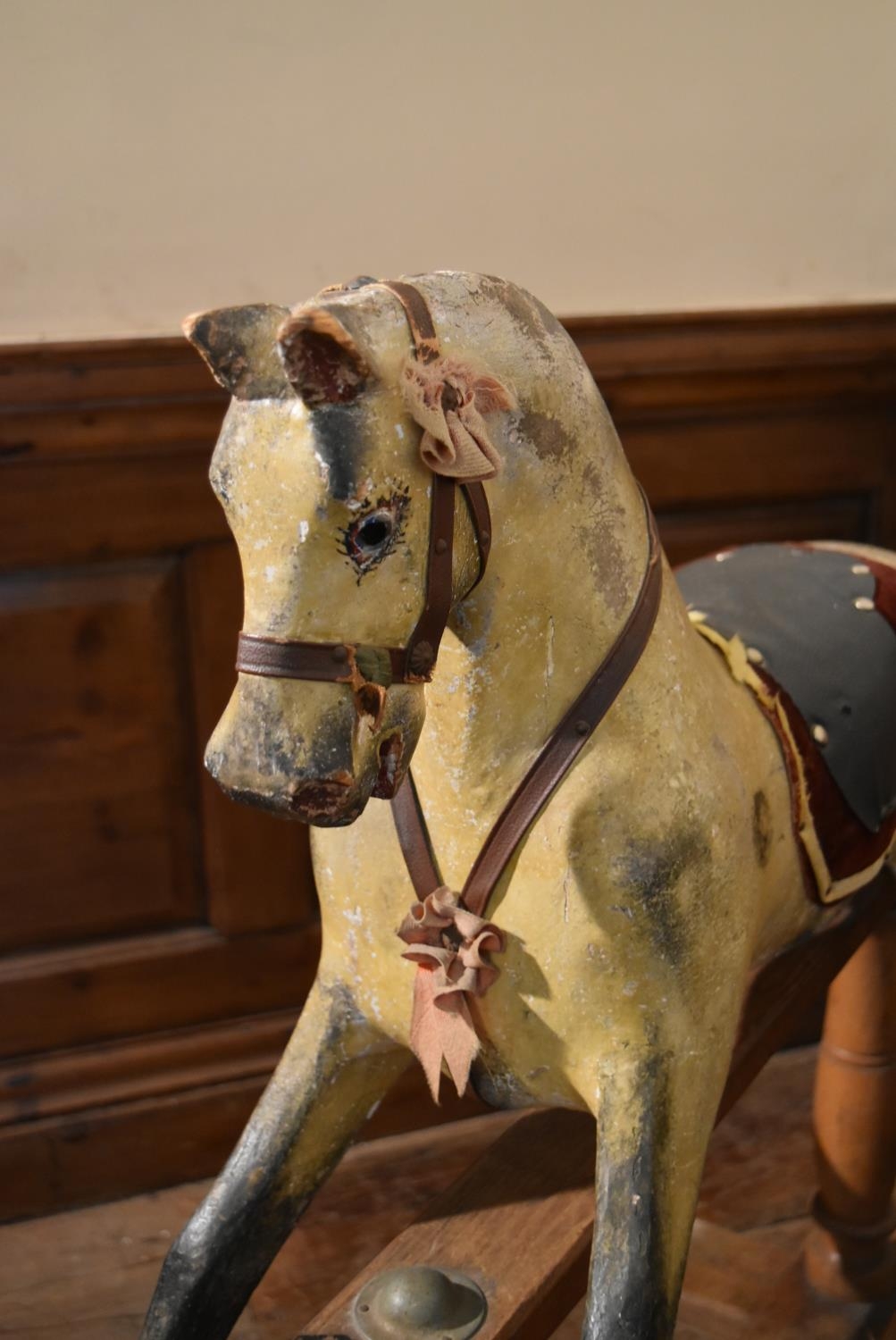 An early 20th century carved and painted Triang rocking horse on swing action oak platform base. H. - Image 4 of 10