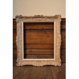 A painted wood and gesso picture frame with slip. H.80 W.70cm