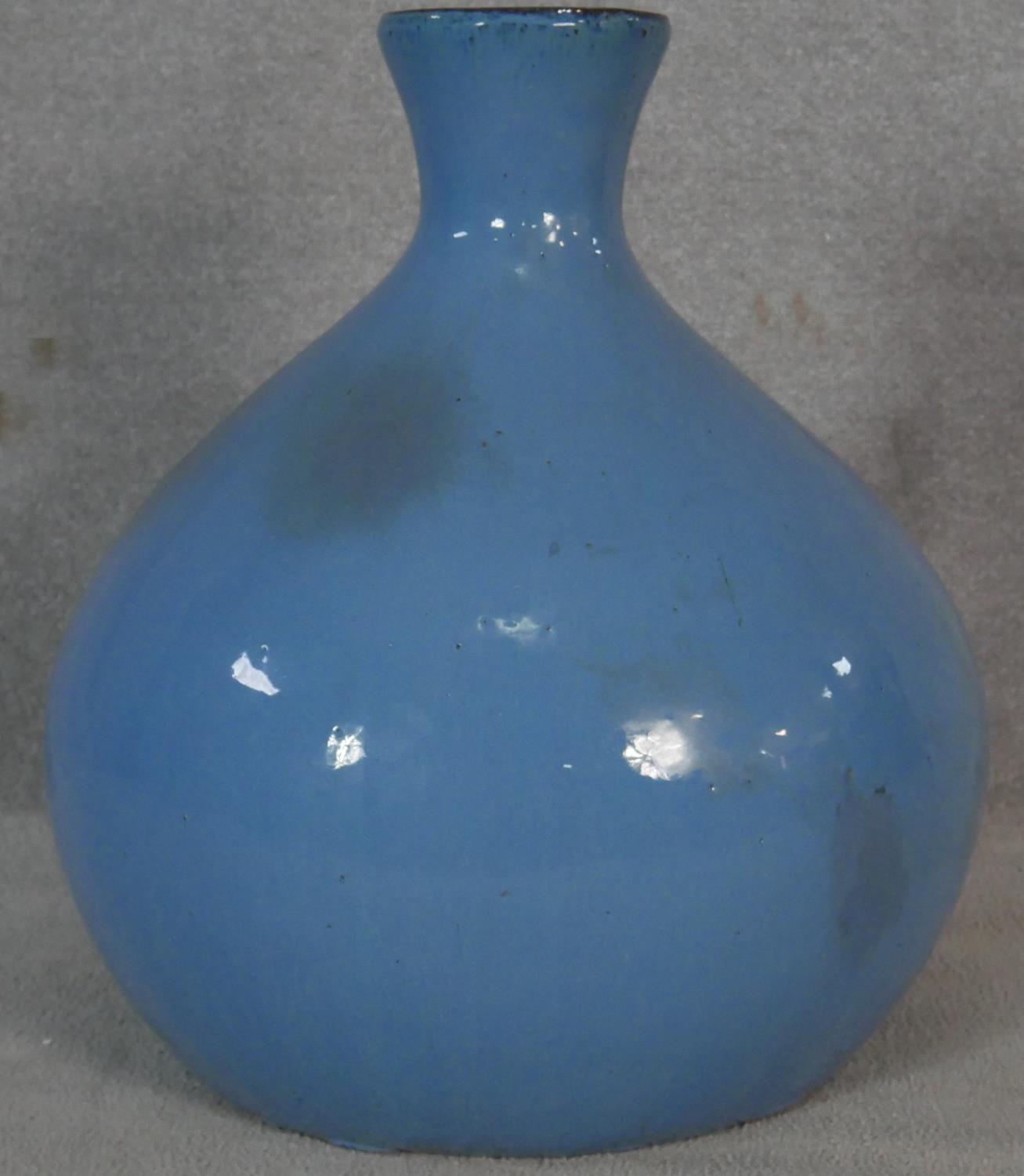 A large bulbous form vase in pale blue glaze. H.60cm