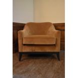A contemporary tub armchair in buttoned velour upholstery. H.78 W.76 D.64cm