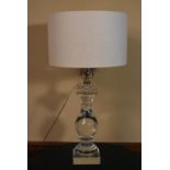 A contemporary Perspex baluster form table lamp. H.78 W.40cm