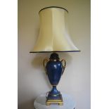 A Classical style painted metal table lamp in the shape of a twin handled lidded urn. H.87 W.23cm