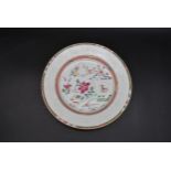 An 18th century Famille Rose Chinese glazed porcelain plate with cuckoo and house design with