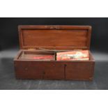 A 19th century mahogany box with fitted lift out trays containing various Mecano pieces. H.15 W.45