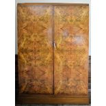 An Art Deco burr walnut gentleman's wardrobe by Compactom Ltd with patent label and travelling