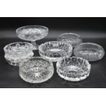 A miscellaneous collection of eight large cut crystal dishes and ashtrays. H.13cm W.21cm