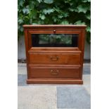A Chinese hardwood cabinet with fall front vitrine section above two drawers on plinth base. H.66