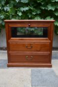 A Chinese hardwood cabinet with fall front vitrine section above two drawers on plinth base. H.66