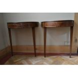 A pair of 19th century mahogany and satinwood strung demi lune console tables with inset leather