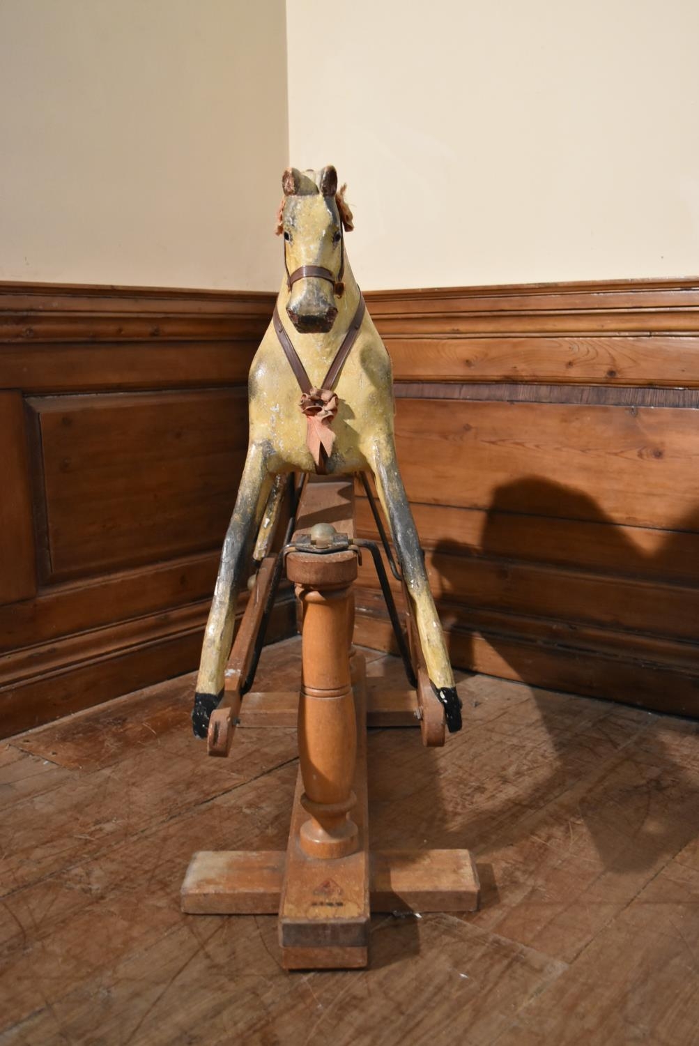 An early 20th century carved and painted Triang rocking horse on swing action oak platform base. H. - Image 3 of 10