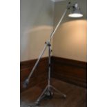 A mid century vintage chromium standard reading lamp. the lamp fitting fully articulated around