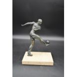 A mid century vintage bronze figure of a footballer kicking the ball standing on marble base. H.28