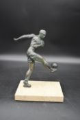 A mid century vintage bronze figure of a footballer kicking the ball standing on marble base. H.28