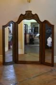 A large carved French style triple mirror. H.130cm W.130cm