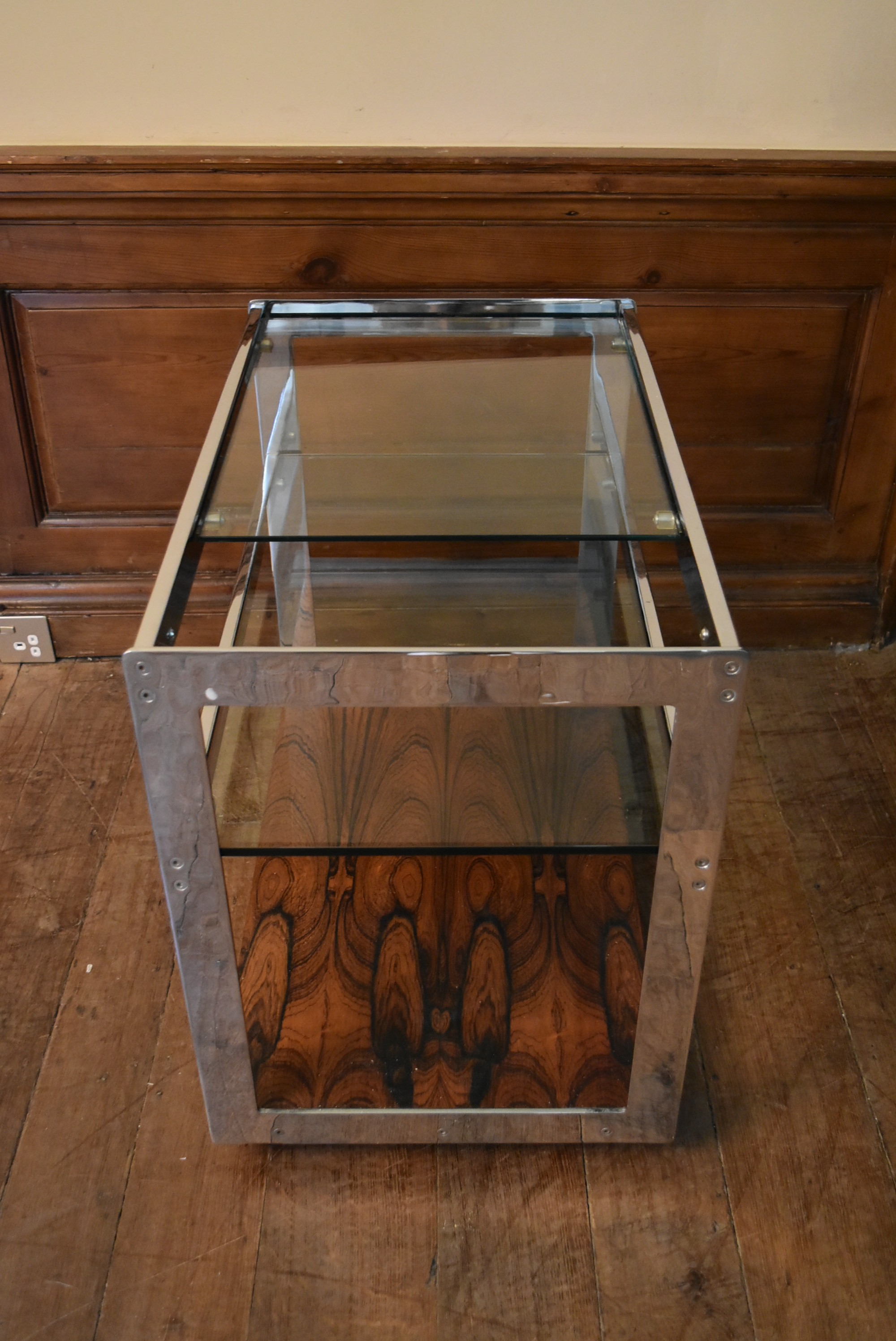 A Merrow Associates chrome framed drinks trolley with plate glass tiers on casters. H.64 W.73 D.46cm - Image 6 of 6