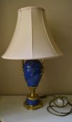 A painted metal faux stone and gilt table lamp in the style of a Classical urn. H.60cm W.20cm