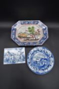 A hand painted Portuguese serving dish, a blue and white Chinese style plate and a Delft style