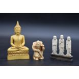 A moulded resin seated Buddha figure and two other similar items. H.15 W.8cm (Buddha)