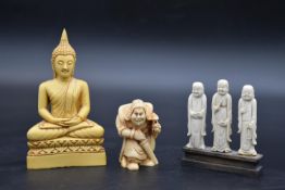 A moulded resin seated Buddha figure and two other similar items. H.15 W.8cm (Buddha)