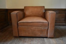 A vintage French leather upholstered armchair converting to single mattress base. H.81 W.106 D.