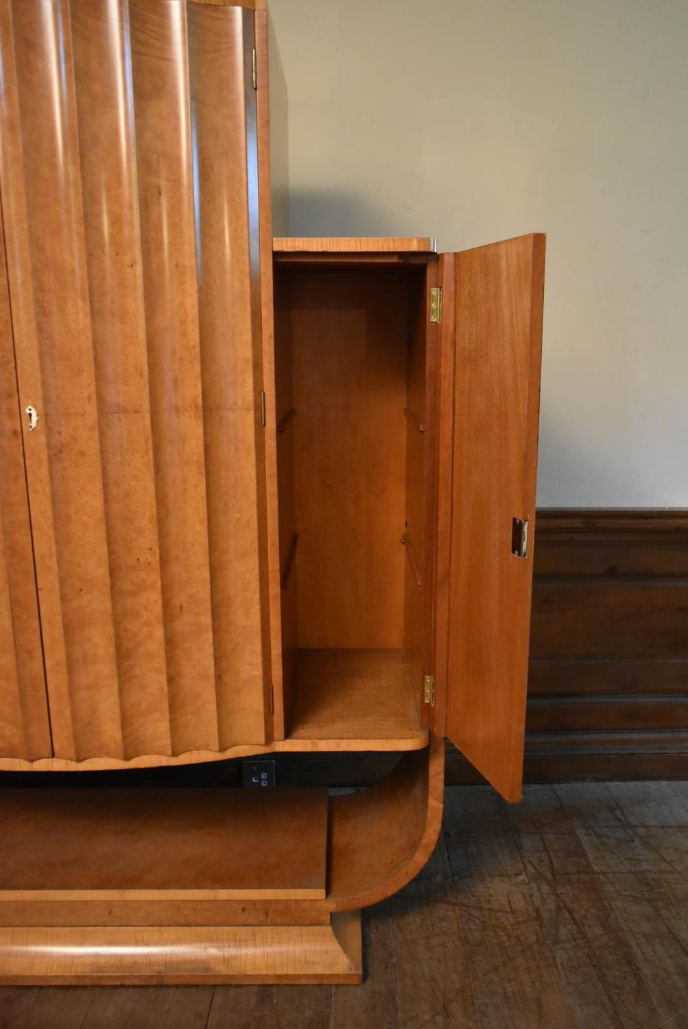 An Art Deco burr walnut cocktail cabinet with ribbed central panel doors enclosing glazed and lit - Image 20 of 23